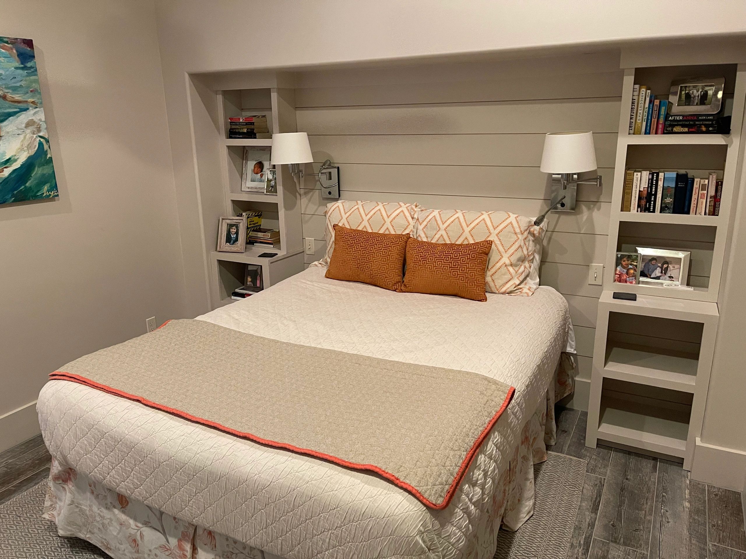 Modern bedroom with built-in shelving and cream tones