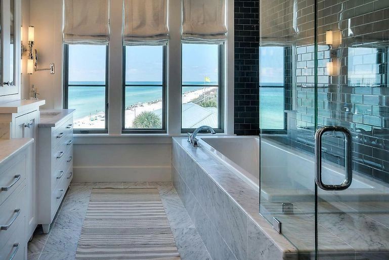 Luxury bathroom with freestanding tub and ocean view