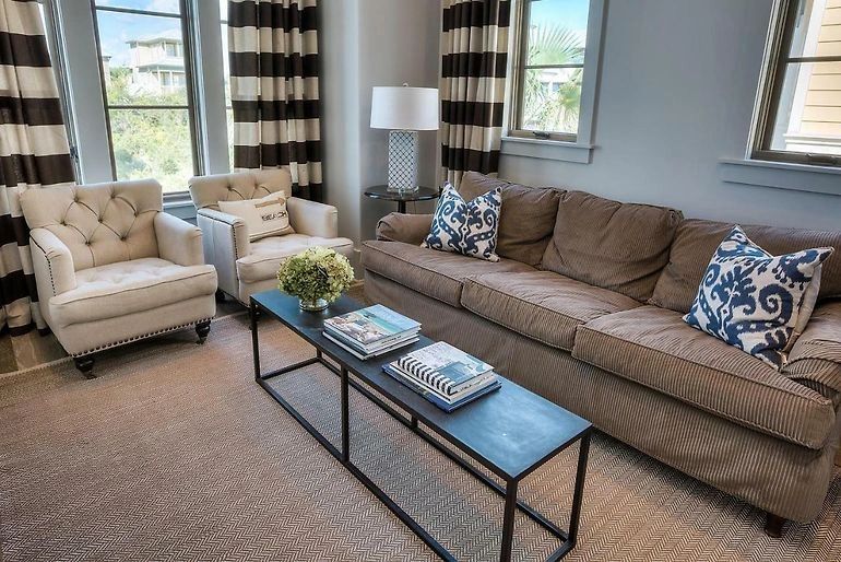 Modern living room with beige sofa and patterned pillows